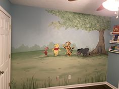 a room with winnie the pooh wall mural