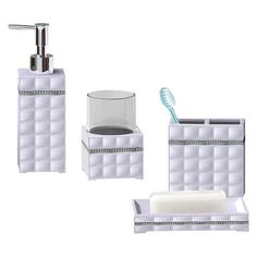 three pieces of bathroom accessories including soap dispenser and toothbrush holder