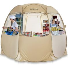 a man standing in front of a tent with food on the outside and an open door