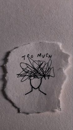 a piece of torn paper with the words too much on it and a drawing of a bee