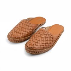 Mens Classic Woven Mule  - Traditional Indian Kolhapuri Leather Bantu | stylish leather slides | Moroccan babouche plus Mexican huaraches style sandals exudes elegance and comfort. The upper is expertly constructed from smooth and supple terracotta leather (TC), offering unparalleled comfort with a luxurious tan hue on the top surface.    The distinctive woven leather strips give the unique appearance, resembling a traditional mat, intricately knotted around the bottom and secured with laces.  E Casual Slip-on Slippers With Leather Lining, Leather Flat Slip-ons With Woven Sole, Casual Woven Leather Slip-ons, Leather Woven Leather Slip-on Sandals, Casual Leather Slides With Woven Sole, Natural Leather Mules With Leather Footbed, Casual Leather Slippers With Woven Sole, Leather Mules With Woven Sole In Natural Color, Leather Slip-ons With Stitched Sole For Beach