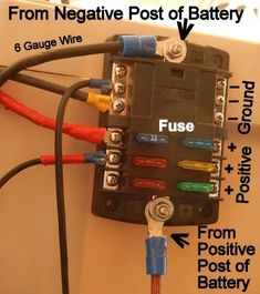 an electrical panel with multiple wires and plugs attached to it, labeled from negative post of battery