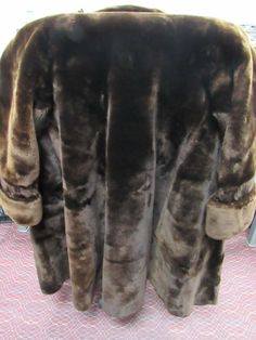 Here is a very Beautiful 3/4 length chocolate fur coat. The coat is in amazing condition. However there is some damage to the liner, This does not affect the wear ability of this very nice Mink. The tag inside the collar is torn out and the seam has come loose on the right side. Again easy fix along the seams, see pics. Since the tag is missing there is no way to know the maker or size. I can say that the measurement from armpit seam to armpit seam is 22" and the length of sleeve from shoulder t Classic Brown Fur Coat With Faux Fur Trim, Classic Brown Faux Fur Outerwear, Brown Long Coat With Faux Fur Trim, Classic Brown Long Fur Coat, Classic Long Brown Fur Coat, Fur Coat Fashion, Winter Fur Coats, The Maker, Chocolate Brown