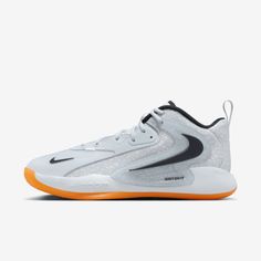 the nike zoom basketball shoe in white and black with an orange soles on top