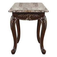 an ornate wooden table with marble top