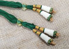 "Bright and beautiful adjustable handmade necklace thread / necklace cotton cord with beaded tassels. Looks good with big pendants or chokers. Necklace cotton dori is 10\" Adjustable. The Dori is made of cotton by master craftspersons and is handmade. You will receive set of two adjustable necklace thread / cotton cord. Other colors also available : https://www.etsy.com/shop/uDazzleSupplies?ref=simple-shop-header-name&listing_id=700504868&search_query=dori WE ALSO DO WHOLESALE. PLEASE CO Traditional Handmade Adjustable Tassel Necklace, Traditional Beaded Necklace With Tassels, White Bohemian Necklaces With Latkans, Bohemian White Necklaces With Latkans, White Beaded Necklaces With Tassels As Gift, White Beaded Necklaces With Tassels For Gift, White Beaded Tassel Necklaces As Gift, Traditional Tassel Necklace For Festival, Handmade Traditional Tassel Necklace Gift