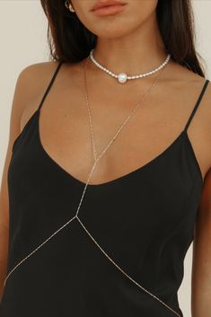 Our first ever body chain is here to stay, featuring an elongated flat box chain in 14k gold-filled. Created to delicately wrap you, this body chain is meticulously crafted with precision and care &  is the epitome of timeless luxury. Wear the Tara body chain all year round - over a slip dress, a bikini, with jeans or your favorite slip dress.

Chain Dimensions: 1.2mm flat box
Measurements: 23” Necklace & 30” Waist
Waterproof & tarnish resistant Elegant Chain Jewelry For Weddings, Elegant Wedding Jewelry Chain, Classic Double Strand Jewelry With Adjustable Chain, Elegant Adjustable Clavicle Chain Jewelry, Elegant Adjustable Clavicle Chain, Elegant Rose Gold Round Chain Necklace, Classic Chain Necklace With Adjustable Chain For Party, Elegant Chain Jewelry For Parties, Classic Party Chain Necklace With Adjustable Chain