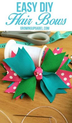 an easy diy hair bow made out of ribbon and fabric with scissors on the side