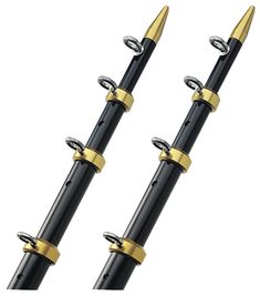 two black and gold fountain pens sitting next to each other