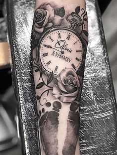 an arm with a clock and footprints on it