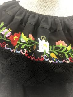 "Vintage 1970s black Mexican embroidered floral boho top MEASUREMENTS: Chest: 40\" Sleeve: 9\" Length: 12.5\" Shoulder to Shoulder: 15\" All measurements taken with garment laid flat. Modern Size Estimate: M CONDITION: Excellent Vintage Condition All items at Time Warp are vintage, so there is some wear. They may not be 100% free of minor defects, as they have already been loved. We list items by condition and note any flaws. Find us on Instagram: @timewarpbr INV 2140" Black Embroidered Peasant Top, Black Peasant Blouse With Floral Embroidery, Black Blouse With Intricate Embroidery For Festival, Spring Embroidered Black Peasant Top, Black Peasant Top With Floral Embroidery For Festivals, Black Cotton Folk Embroidered Top, Black Embroidered Peasant Blouse, Peasant Style Embroidered Black Blouse, Black Embroidered Peasant Top For Festivals