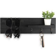 Return Policy Fast Delivery Trusted seller Key Holder for Wall, Decorative Entryway Shelf with Hooks Holds Keys, Dog Leash, Sunglasses – Key Hanger with 3 Hooks Organizes, Enhances Home Decor (15” x 4.5” x 2.6”) (Black) Product Description ORGANIZE WITH FLAIR using the beautiful Key Hanger for wall with shelf. Our key organizer has 3 key hooks, a shelf and a hanger to hold ID lanyards, sunglasses and dog leashes in 1 central locale. NATURAL PAULOWNIA WOOD adds an elegant touch to your entryway decor. Three widely-spaced hooks support bags, several sunglasses and other personal items on this 15”W x 4.5”H x 2.6”D wall key holder. ELEVATE YOUR WALL DECOR with a key wall holder finished in a stain that complements a living room, office, bedroom or entry hall. Each key organizer has knots and w Key Hanger Entryway, Entryway Shelf With Hooks, Key And Letter Holder, Looking For Apartments, New Apartment Gift, Shelf With Hooks, Key Holder For Wall