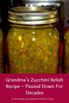 three jars filled with pickles sitting on top of a red tablecloth covered floor