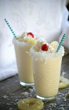 two glasses filled with ice cream and banana slices