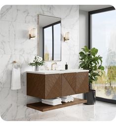 a bathroom with marble counter tops and wooden cabinetry, along with a large window