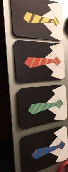 four pieces of paper with different colored arrows on them