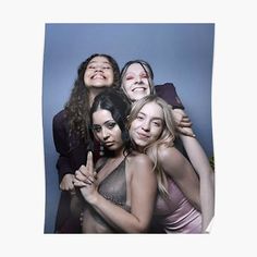 four women posing for the camera with their arms around each other