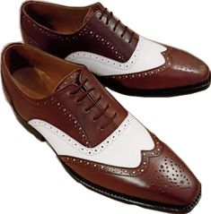 White Oxford Wingtip Dress Shoes, White Wingtip Lace-up Shoes For Business, White Oxford Dress Shoes For Semi-formal Occasions, White Brogue Lace-up Shoes For Derby, White Cap Toe Leather Shoes, White Oxford Leather Shoes With Rubber Sole, White Oxford Leather Shoes With Cap Toe, Fitted White Leather Dress Shoes, White Leather Cap Toe Shoes