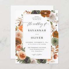 an elegant wedding card with flowers and greenery