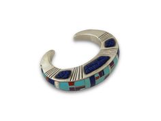 New, one of a kind Ben Nighthorse bracelet! Sterling silver inlaid with turquoise, coral lapis, sugilite and white opal. 7/8” wide, sits 3/4” high and is a size 6 1/2. Collectible Inlay Bracelet Jewelry, Blue Inlay Bracelet Jewelry, Southwestern Style Blue Inlay Bracelets, Blue Inlay Bracelet, Artisan Blue Bracelets Collectible, Artisan Sterling Silver Bracelet With Inlay, Unique Blue Sterling Silver Bangle Bracelet, Multicolor Inlay Sterling Silver Bracelets, Multicolor Sterling Silver Bracelet With Inlay