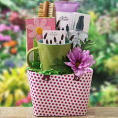 a green and white polka dot container filled with lots of different types of items on top of a table