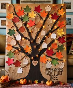 a family tree is decorated with thanksgiving leaves