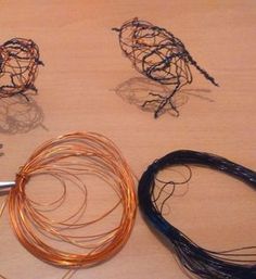 several pieces of wire sitting on top of a table