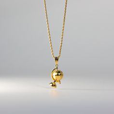 Show your love for mother Earth in the form of this 14K gold 3D Globe pendant. This unique gold jewelry features a 3D globe suspended from the semi-meridian at a slight angle, giving it a dynamic and elegant appearance. This 14k gold pendant is the perfect representation of how beautiful mother earth is. It is an ideal gift for anyone who loves traveling the globe. Our 3D gold globe pendant necklace will help get them there in style. This beautiful gold globe charm will make a timeless addition Yellow Gold Orb Jewelry Gift, Yellow Gold Orb Jewelry For Gift, Orb-shaped Gold Jewelry For Gift, Unique Gold Jewelry, 3d Globe, Globe Necklace, Summer Choker, Gold Globe, Bracelet Summer