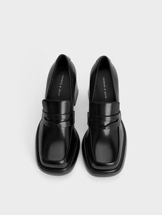 The masculine shoe style gets a touch of playfulness with these Monique pumps. Featuring a sculptural chunky silhouette, the classic loafers have been elevated with padded platform outsoles and rounded square toes for bold and striking look. In a glossy black finish, they will go well with most outfits yet add dramatic flair to even monochromatic ensembles. Set on impressive block heels, they will boost your height and stature - incorporate them into your workwear for a fun twist on the formal style. Loafer Pumps, Classic Loafers, Rounded Square, Platform Loafers, Black Loafers, Charles Keith, Formal Style, Black Box, Shoe Style