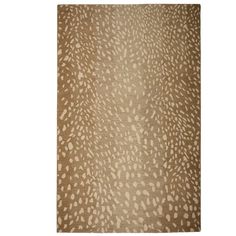 a brown rug with white spots on it