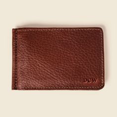 Brown money clip wallet with DCW letters monogrammed on the bottom right corner Classic Bifold Card Holder With Flat Pocket, Classic Rectangular Wallet With Flat Pocket, Classic Rectangular Card Holder With Flat Pocket, New Money, Foreign Currency, Sustainable Leather, Clip Wallet, Money Clip Wallet, Naturally Dyed