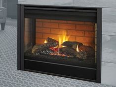 a fireplace that is lit up with the fire burning in it's side panel