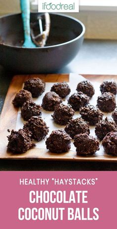 healthy haystacks'chocolate coconut balls on a cutting board next to a frying pan