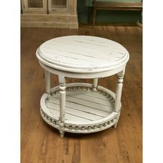 a white wooden table sitting on top of a hard wood floor