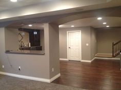 an empty living room with hard wood flooring and white trim on the walls is shown