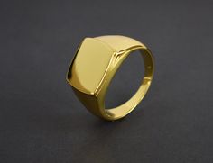 This listing is for 14k Gold Filled signet ring the base metal is 925 sterling silver. this is a timeless classic that goes with just about any look and will look great both on man and woman. What is Gold Fill? It's an actual layer of gold-pressure bonded to another metal. Gold filled is not to be confused with gold plating as filled literally has 100% more gold than gold plating. Gold filled is much more valuable and tarnish resistant. It does not flake off, rub off or turn colors. As a matter Shiny Finish Round Band Rings For Gift, Round Band Rings With Shiny Finish For Gift, Gift Round Band Ring With Shiny Finish, Polished Open Ring Jewelry For Gifts, Gold Jewelry With Polished Edges For Gift, Gift Jewelry With Polished Edges Open Ring, Yellow Gold Jewelry With Polished Edges For Gifts, Gold Rings With Shiny Finish For Gift, Luxury Rings With Polished Edges As Gift