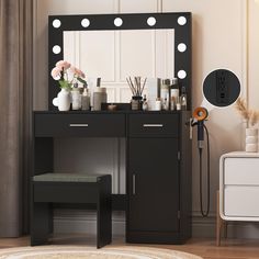 a vanity with lights on it and a stool in front of the mirror that is open