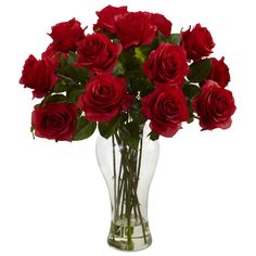 a vase filled with red roses on top of a table