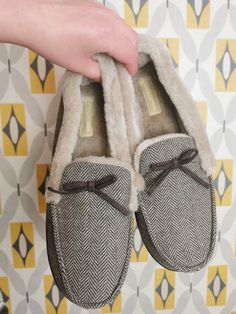 A great pair of vintage 80s mens slippers. Herringbone fabric with faux fur lining and leather bow. These are vintage deadstock - brand new and unworn. Uk  size 11-12 length 29cm width 10cm. All vintage items are over 30 years old and may show signs of wear. Please take a look at my other vintage pieces on my etsy shop! www.moonmusevintage.etsy.com 80s Mens, Herringbone Fabric, 30 Years Old, Christmas Gifts For Him, Leather Bows, Mens Slippers, Herringbone, Faux Fur, Shoes Mens