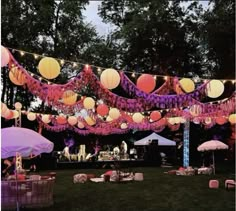 an outdoor party with paper lanterns and decorations