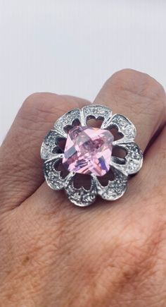 Unusual pale pink ice CZ Deco sterling setting handmade  Size 7 Can be resized. My jeweler charges $20 All rings are shipped in a nice gift box.   Check out our over a THOUSAND great reviews Engraving is $4 per letter and is not always perfect depending on the piece. It can take a few days if the jeweler is busy. This is payable to Paypal Judithsltd@gmail.com Pink Sterling Silver Crystal Ring With Gem, Vintage Pink Jewelry For Anniversary, Pink Vintage Jewelry For Anniversary, Hallmarked Pink Ring Jewelry, Pink Sterling Silver Jewelry With Prong Setting, Vintage Pink Gemstone Jewelry, Unique Pink Ring Jewelry, Silver Crystal Ring With Center Stone As Gift, Handmade Sterling Silver Pink Rings