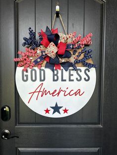 a patriotic door hanger that says god bless america