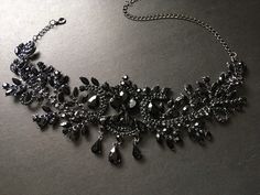 "This romantic and gothic style design wedding bridal choker necklace linked to cable chain finished with sparkle crystals at end for you to adjust the length. Size: necklace measures around 14.5\" long x center drop 3.1\" Color: dark silver with black rhinestone crystals and glass stones Item ship out with tracking number to you (around 10 to 14 business days for delivery). We also provide fast shipping service, around 3-4 business days delivery but need to add extra charge. Please convo us if Luxury Black Spinel Jewelry For Evening, Gothic Wedding Necklaces With Jewels, Elegant Black Rhinestone Necklace For Wedding, Elegant Black Choker With Adjustable Chain, Party Black Rhinestone Metal Necklace, Black Metal Rhinestone Necklace For Party, Glamorous Black Metal Jewelry, Black Jeweled Choker Necklace, Glamorous Rhinestone Necklace For Wedding With Adjustable Chain