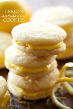 a stack of yellow and white cookies sitting next to each other on top of a table