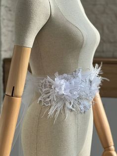 This white tulle ribbon belt, lace and flower wedding sash will make a beautiful addition to your wedding dress with a touch of modern style. The top quality tulle sash ribbon is  300 centimeters long which will allow for a big bow or to flow freely on your dress. The ribbon is available in many other colors, just check out the color drop down menu! Tulle ribbon color as pictured is white and Embellishment is white Rustic Sash, lace wedding Sash, laced bridal sash, Bridal sash, lace wedding belt, lace bridal belt, off white lace sash/belt, belt with feathers White Fitted Bridal Belt For Ceremony, White Bridal Belt For Bride, White Fitted Lace Bridal Belt, White Lace Bridal Belt For Ceremony, Fitted White Lace Bridal Belt, White Lace Wedding Sash, White Fitted Bride Sash, White Bridal Accessories With Sashes, Vintage Rustic Wedding