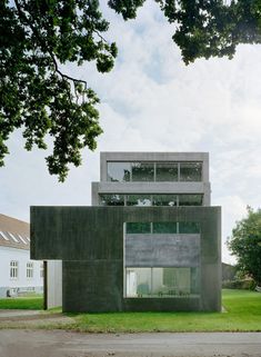 the building is made out of concrete and has windows on each side that are open to let in light