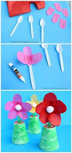 paper flowers and plastic spoons are on the same blue surface, with one flower sticking out of it