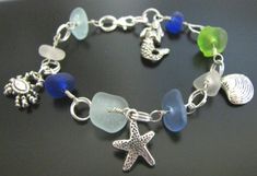 THE SEA GLASS: The 8 rare sea glass pieces in this well made, nautical bracelet were each beachcombed by me from a shore along the majestic Pacific Ocean. The dusty blues may have originated from a vintage, medicine bottle, the aqua from a canning jar pieces and the soft seafoams Blue Nautical Jewelry For Beach, Blue Bracelets With Lobster Clasp For Beach, Beach Glass Bracelet Jewelry, Handmade Nautical Bracelets For Beach, Handmade Nautical Style Bracelets For Beach, Nautical Style Blue Bracelets For Beach, Ocean-inspired Bracelets With Lobster Clasp For Vacation, Ocean-inspired Bracelet For Vacation, Ocean-inspired Recycled Glass Beach Jewelry