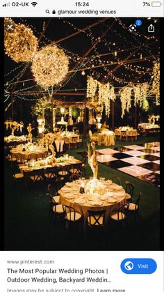 an outdoor event with tables and chairs covered in lights, chandeliers and decorations