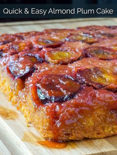 a close up of a piece of cake on a wooden cutting board with the words quick and easy plum cake